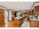 Stylish kitchen with wood cabinets, island, granite countertops, and stainless appliances at 3267 Remembrance Trce, Lawrenceville, GA 30044