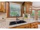 Close-up of kitchen sink with black faucet and granite countertop at 3267 Remembrance Trce, Lawrenceville, GA 30044