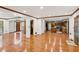 Open floor plan with hardwood floors connecting the living room and kitchen at 3267 Remembrance Trce, Lawrenceville, GA 30044