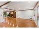 Spacious living room featuring hardwood floors, a fireplace, and plenty of natural light at 3267 Remembrance Trce, Lawrenceville, GA 30044