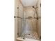 Elegant tiled shower featuring glass doors and modern fixtures at 3267 Remembrance Trce, Lawrenceville, GA 30044