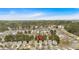 Community aerial view of neighborhood homes surrounded by tree canopy and a nearby lake at 3417 Sable Chase Ln, Atlanta, GA 30349