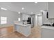 Bright, updated kitchen featuring white cabinetry, stainless steel appliances, and a functional breakfast bar at 3417 Sable Chase Ln, Atlanta, GA 30349