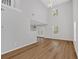 Sunlit open-concept living space featuring hardwood floors, high ceilings, and large windows at 3417 Sable Chase Ln, Atlanta, GA 30349