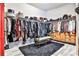 Well-organized walk-in closet with custom shelving and storage solutions and a plush carpet at 1250 Atherton Park, Roswell, GA 30076