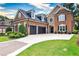 Beautiful brick home featuring a well-manicured lawn, three-car garage, and a blend of brick and stone at 1250 Atherton Park, Roswell, GA 30076