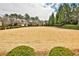 Expansive front yard with lush landscaping and mature trees in a suburban neighborhood at 1250 Atherton Park, Roswell, GA 30076