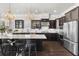Well-appointed kitchen with stainless appliances, a spacious island, and dark wood cabinets at 1250 Atherton Park, Roswell, GA 30076