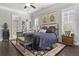 Cozy main bedroom with dark wood floors, plantation shutters, and a stylish ensuite bath at 1250 Atherton Park, Roswell, GA 30076