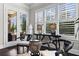 Cozy sitting area with bright windows, plantation shutters, and unique, traditional furnishings at 1250 Atherton Park, Roswell, GA 30076