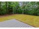 View of the backyard, showcasing the lush green space at 12995 Bucksport Dr, Roswell, GA 30075