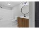Bathroom with vanity, shower-tub combo, stylish light fixture, and modern finishes at 12995 Bucksport Dr, Roswell, GA 30075