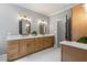 Charming bathroom features double sinks, stylish lighting, and modern finishes at 12995 Bucksport Dr, Roswell, GA 30075