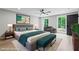 This spacious bedroom features natural light and modern decor to create a comfortable retreat at 12995 Bucksport Dr, Roswell, GA 30075