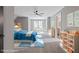 Well lit bedroom features blue decor, ceiling fan and large window at 12995 Bucksport Dr, Roswell, GA 30075