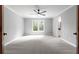 Spacious bedroom with large window and neutral finishes at 12995 Bucksport Dr, Roswell, GA 30075