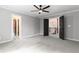 Bonus room features grey paint and two open doorways at 12995 Bucksport Dr, Roswell, GA 30075