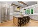 Bright kitchen with a large center island, modern appliances, and ample natural light at 12995 Bucksport Dr, Roswell, GA 30075