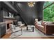Elegant living room boasts a fireplace, custom millwork, and abundant natural light at 12995 Bucksport Dr, Roswell, GA 30075