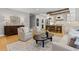Open-concept living room and kitchen with stylish furnishings and stainless steel appliances at 12995 Bucksport Dr, Roswell, GA 30075