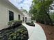 Landscaped walkway leads to home's entrance, enhancing curb appeal and charm at 12995 Bucksport Dr, Roswell, GA 30075