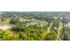 Expansive aerial view of a neighborhood featuring lush greenery, homes and the surrounding cityscape at 157 Shadburn Ferry Rd, Buford, GA 30518