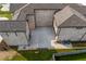 Aerial view of the brick home with attached garage and extended driveway at 157 Shadburn Ferry Rd, Buford, GA 30518
