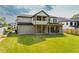 Spacious backyard featuring a covered patio and well-maintained lawn at 157 Shadburn Ferry Rd, Buford, GA 30518