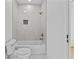Modern bathroom features a tub, white tile and white cabinets at 157 Shadburn Ferry Rd, Buford, GA 30518
