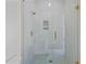 Beautiful bathroom shower with clear glass door and mosaic tile floor at 157 Shadburn Ferry Rd, Buford, GA 30518