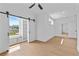Bedroom with hardwood floors, a ceiling fan, barn door, and built in shelving at 157 Shadburn Ferry Rd, Buford, GA 30518