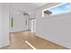Bedroom with hardwood floors, ceiling fan and a barn door leading to another room at 157 Shadburn Ferry Rd, Buford, GA 30518