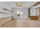 Spacious dining room with hardwood floors, custom cabinetry, and elegant lighting at 157 Shadburn Ferry Rd, Buford, GA 30518