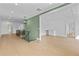 Spacious hallway features hardwood floors, and access to an office nook with built-ins at 157 Shadburn Ferry Rd, Buford, GA 30518