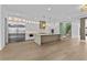 Well-lit modern kitchen features a spacious island and stainless steel appliances at 157 Shadburn Ferry Rd, Buford, GA 30518