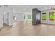 Bright living room with modern fireplace, hardwood floors, and beautiful architectural ceiling at 157 Shadburn Ferry Rd, Buford, GA 30518
