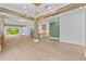 Expansive living room boasts wood floors, beams, and a striking gold chandelier at 157 Shadburn Ferry Rd, Buford, GA 30518