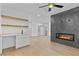 Open floor plan features custom fireplace, wet bar, and access to other living spaces at 157 Shadburn Ferry Rd, Buford, GA 30518