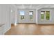 Bright Living room with beautiful hardwood floors, high ceilings, and an abundance of natural light at 157 Shadburn Ferry Rd, Buford, GA 30518