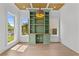 Bright office space featuring a built-in desk, natural light, and hardwood floors at 157 Shadburn Ferry Rd, Buford, GA 30518
