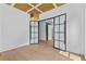 Bright, open office area with glass doors, hardwood floors, and modern design at 157 Shadburn Ferry Rd, Buford, GA 30518
