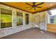 Screened-in porch features a ceiling fan, wood ceiling and brick siding at 157 Shadburn Ferry Rd, Buford, GA 30518