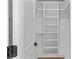 Organized walk-in closet with custom shelving and wood floors at 157 Shadburn Ferry Rd, Buford, GA 30518