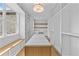 Large walk-in closet features custom shelving and center island with marble top at 157 Shadburn Ferry Rd, Buford, GA 30518