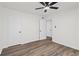 The bright bedroom is complimented by new flooring and a ceiling fan at 169 Peyton Sw Pl, Atlanta, GA 30311