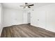 Bright bedroom with wood-look flooring and a modern ceiling fan at 169 Peyton Sw Pl, Atlanta, GA 30311
