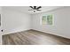 Bright bedroom with wood-look flooring and a modern ceiling fan at 169 Peyton Sw Pl, Atlanta, GA 30311