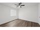 Bedroom featuring wood-look floors, bright natural light, and ceiling fan at 169 Peyton Sw Pl, Atlanta, GA 30311