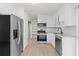 Bright kitchen featuring stainless steel appliances and ample cabinet space at 169 Peyton Sw Pl, Atlanta, GA 30311