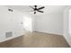 Spacious living area showcasing wood floors and neutral walls with view into adjacent room at 169 Peyton Sw Pl, Atlanta, GA 30311